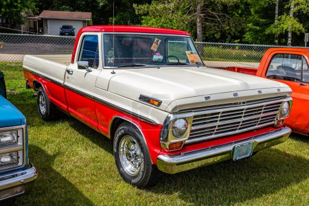 Photo for Iola, WI - July 07, 2022: High perspective front corner view of a 1968 Ford F250 Camper Special Pickup Truck at a local car show. - Royalty Free Image