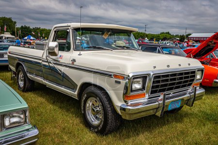 Photo for Iola, WI - July 07, 2022: High perspective front corner view of a 1979 Ford F250 Ranger XLT Camper Special at a local car show. - Royalty Free Image