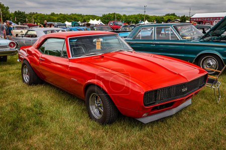 Photo for Iola, WI - July 07, 2022: High perspective front corner view of a 1967 Chevrolet Camaro SS Coupe at a local car show. - Royalty Free Image