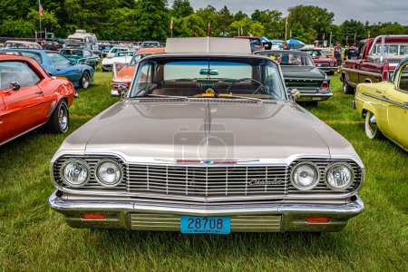 Photo for Iola, WI - July 07, 2022: High perspective front view of a 1964 Chevrolet Impala 2 Door Hardtop at a local car show. - Royalty Free Image