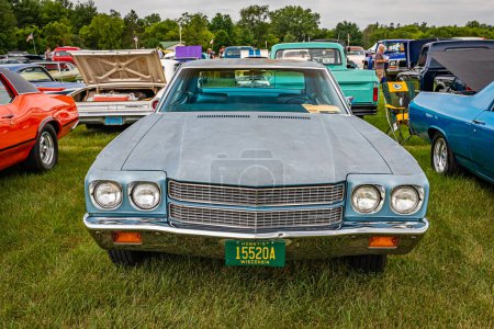 Photo for Iola, WI - July 07, 2022: High perspective front view of a 1970 Chevrolet Chevelle Malibu 4 Door Hardtop at a local car show. - Royalty Free Image
