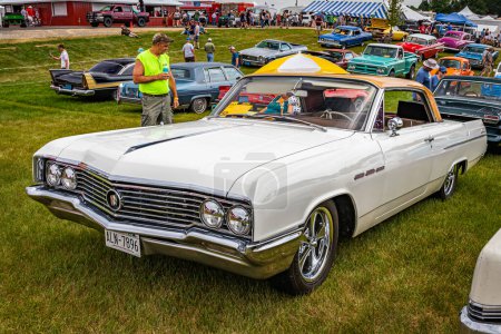 Photo for Iola, WI - July 07, 2022: High perspective front corner view of a 1964 Buick LeSabre 2 Door Hardtop at a local car show. - Royalty Free Image
