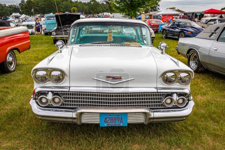 Photo for Iola, WI - July 07, 2022: High perspective front view of a 1958 Chevrolet BelAir 2 Door Sedan at a local car show. - Royalty Free Image
