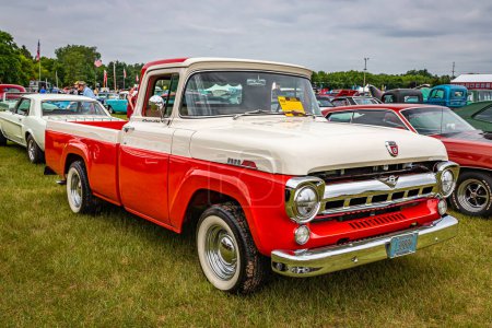 Photo for Iola, WI - July 07, 2022: High perspective front corner view of a 1957 Ford F-250 Styleside Pickup Truck at a local car show. - Royalty Free Image