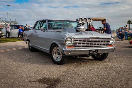 Photo for Daytona Beach, FL - November 26, 2022: Wide angle front corner view of a 1964 Chevrolet Nova Pro Street at a local car show. - Royalty Free Image