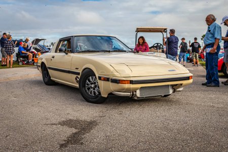 Photo for Daytona Beach, FL - November 26, 2022: Wide angle front corner view of a Customized 1985 Mazda RX-7 GSL at a local car show. - Royalty Free Image