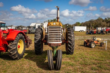 Photo for Fort Meade, FL - February 22, 2022: High perspective front view of a 1964 Cockshutt Model 770 Standard Tractor at a local tractor show. - Royalty Free Image