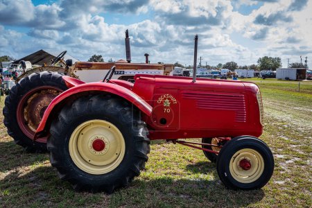 Photo for Fort Meade, FL - February 22, 2022: High perspective side view of a 1947 Cockshutt Model 70 Tractor at a local car show. - Royalty Free Image