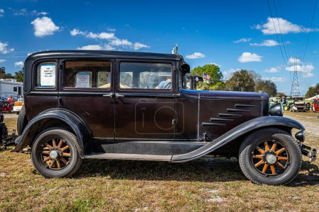 Fort Meade, FL - February 24, 2022: Low perspective side view of a 1930 Durant Model 614 Standard Sedan at a local car show.