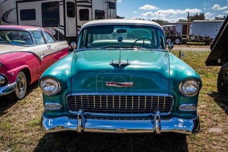 Photo for Fort Meade, FL - February 24, 2022: High perspective front view of a 1955 Chevrolet Bel Air 4 Door Sedan at a local car show. - Royalty Free Image