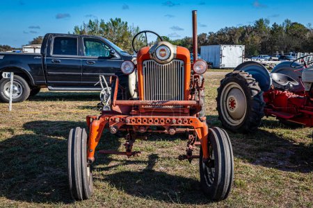Photo for Fort Meade, FL - February 26, 2022: High perspective front view of a 1958 Ford 601 Workmaster Tractor at a local tractor show. - Royalty Free Image