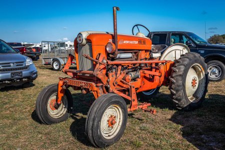 Photo for Fort Meade, FL - February 26, 2022: High perspective front corner view of a 1958 Ford 601 Workmaster Tractor at a local tractor show. - Royalty Free Image