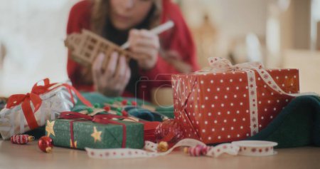 Photo for Woman Decorating For Christmas Gifts Xmas Time Woman Dressed For Holidays Celebrating Xmas - Royalty Free Image