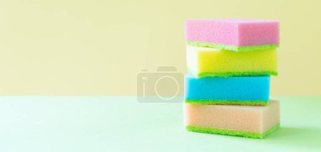 Photo for Cleaning concept - colorful dishwashing sponges on bright background, copy space - Royalty Free Image