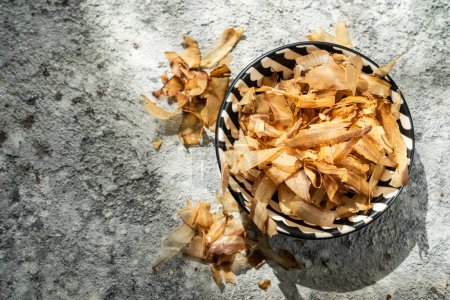 Photo for Bonito flakes on rustic background, direct sun light. High quality photo - Royalty Free Image