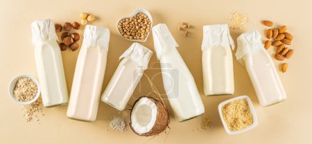 Photo for Plant based milk concept - selection of alternative milks, top view - Royalty Free Image