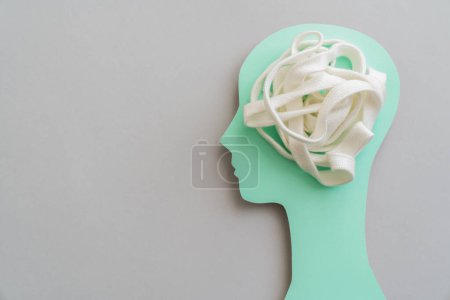 Photo for Therapy concept - white tangled lace in head profile, top view - Royalty Free Image