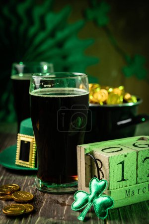 Photo for St Particks day concept - beer, pot of gold, calendar, hat, copy space - Royalty Free Image