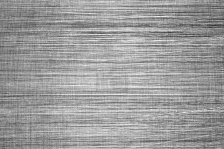 Monochrome texture of shiny scratched metal. Abstract background for design.