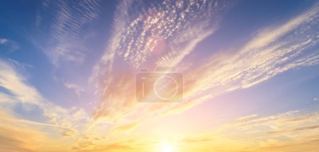 Photo for The rays of the sun breaking through the dramatic clouds in the evening or in the morning in the sunset or dawn sky. The concept of faith, hope for the best or good weather. - Royalty Free Image