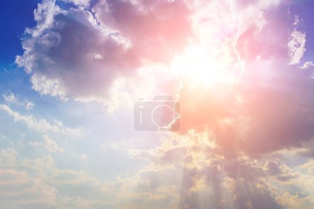 Photo for Sunbeams breaking through dramatic cumulus clouds. Weather change from stormy to sunny. Hope or religion concept. - Royalty Free Image