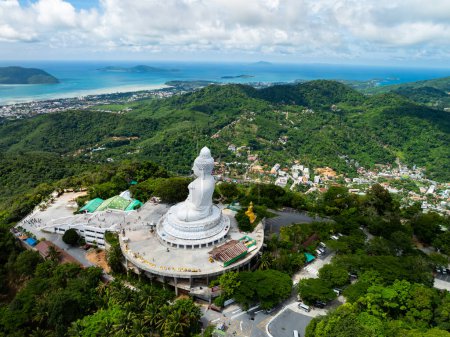 Vesak day background concept of Big buddha over high mountain in Phuket thailand Aerial view drone shot