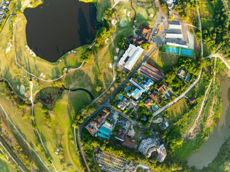 Aerial view drone shot of beautiful green golf field at Phuket island Thailand,Wide angle Top view golf course