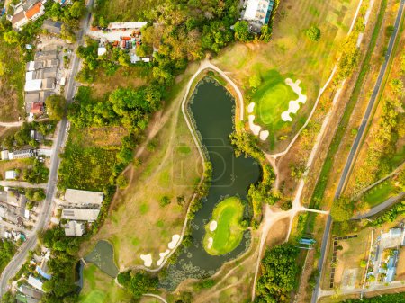 Aerial view drone shot of beautiful green golf field at Phuket island Thailand,Wide angle Top view golf course