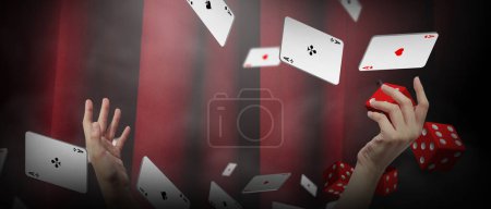 Photo for Online casino, play poker cards and dice on black-Rad background in a dark scene with smoke with neon lights. Playing cards in a man's hand, Copy space, banner -3d Rendering - Royalty Free Image