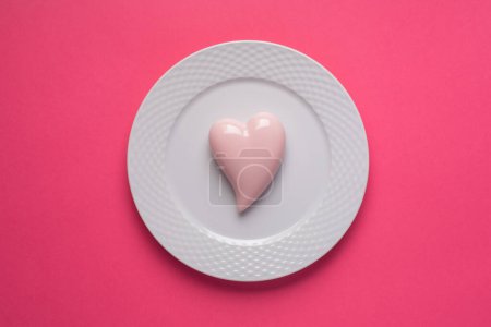 Photo for Pink heart on a pink background. Simple concept for Valentines day holiday. High quality photo - Royalty Free Image