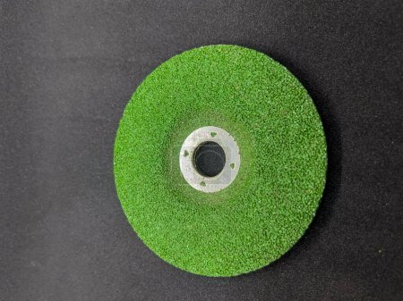 Photo for Green sanding grinding wheel isolated on black background - Royalty Free Image