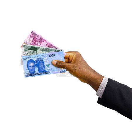 Black hand with suit holding New Nigerian Naira notes isolated on white background, 3d rendering