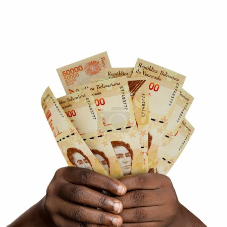 Foto de Manos negras sosteniendo notas bolívares venezolanas en 3D. primer plano de las manos con billetes en moneda venezolana - Imagen libre de derechos