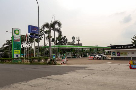 Photo for BP British Petroleum Gas Station at Purbaleunyi Toll Road KM 72, Purwakarta, Indonesia equipped with supporting retail outlets such as Alfa Mart and Kimia Farma pharmacy - Royalty Free Image