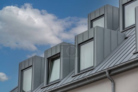 Photo for Straight dormers on a sloping tin roof - Royalty Free Image