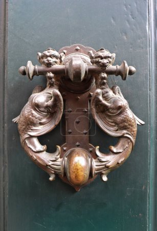 Close up view of door knocker in Rome, Italy