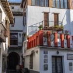 Granada, Spain, February 7, 2024. Street and houses in the popular neighborhood of Albaicin, in Andalucia, Spain. High quality photo