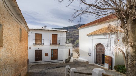 Photo for Capileira, Spain, February 8, 2024. Street and houses in the town of Capileira, in the Alpujarra of Granada, in Andalusia High quality photo - Royalty Free Image