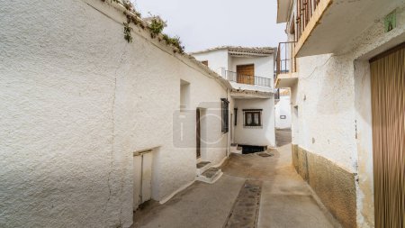 Photo for Capileira, Spain, February 8, 2024. Street and houses in the town of Capileira, in the Alpujarra of Granada, in Andalusia High quality photo - Royalty Free Image