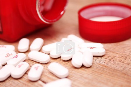Photo for WASHINGTON, USA - October 15, 2022: Bottle Of Tylenol Extra Strength With Many Pills On A Wooden Table - Royalty Free Image