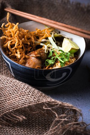 Khao Soi Kai or Khao Soi Gai, Northern Thai cuisine, Egg noodles with spicy yellow curry and chicken