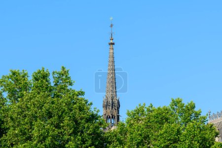 Photo for This landscape photo was taken, in Europe, in France, in ile de France, in Paris, on the banks of the Seine, in summer. We see the bell tower of the Sainte Chapelle on the Ile de la Cite, under the Sun. - Royalty Free Image