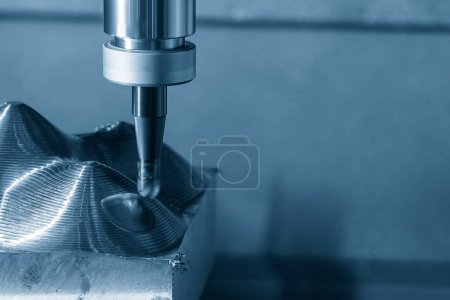 Photo for Close up scene the CNC milling machine rough cutting the mold parts by indexable ball tools. The mold and die manufacturing process by machining center with the solid endmill tools. - Royalty Free Image