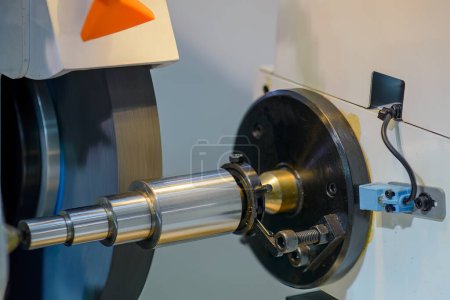 Photo for Close up scene the cylindrical grinding machine operation. The metal working process by grinding machine. - Royalty Free Image