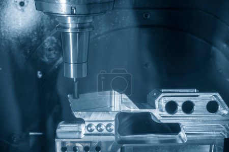 The 5-axis machining center cutting aerospace parts with solid ball end mill tool. The hi-precision automotive manufacturing process by multi-axis CNC milling machine.