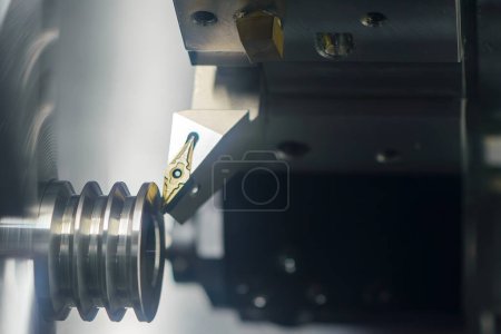 Photo for The  CNC lathe machine forming  cutting the metal shaft parts. The hi-technology metal working processing by CNC turning machine . - Royalty Free Image