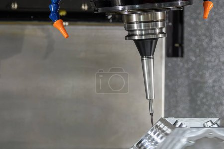 The 5-axis machining center cutting the V8 engine cylinder block with solid ball end mill tool. The hi-precision automotive manufacturing process by multi-axis CNC milling machine.