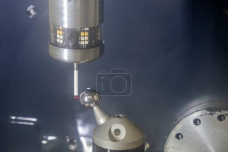 The touching probe calibration process with 3D sphere ball. The quality control of CNC milling machine.