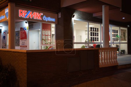 Photo for Alcobendas, Madrid - Spain - March 8, 2023: Facade of REMAX international shop exterior and sign in the evening - Royalty Free Image