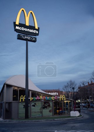 Photo for Alcobendas, Madrid , Spain - March 8, 2023: Illuminated McDonalds Restaurant facade with logo in the evening - Royalty Free Image
